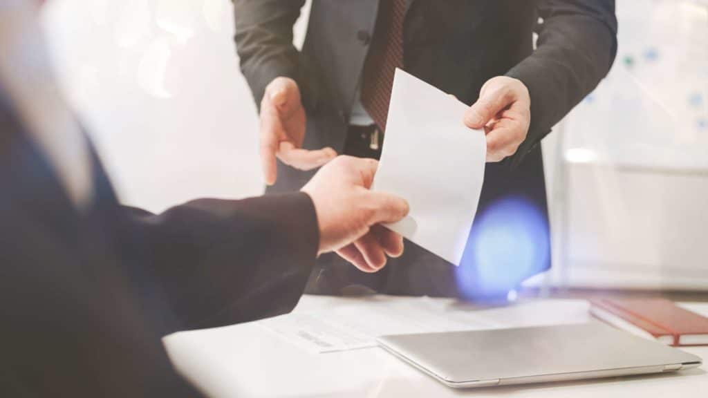 interior design business coach handing paper
